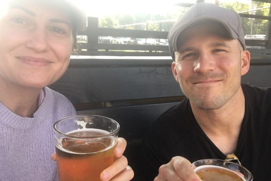 a man and woman enjoying a few beers on a sunny day in Durham, NC