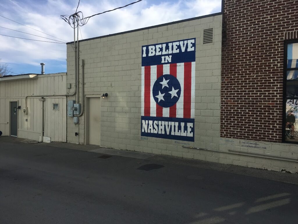 street art in Nashville reads I Believe in Nashville written across an american flag