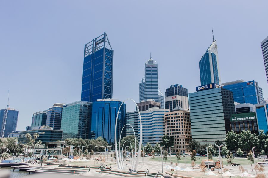 The Perth city skyline. Tall skyscrapers and apartment buildings line the view on a clear day in Perth.