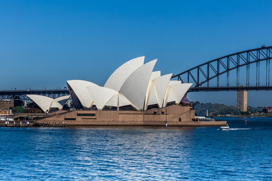 The Sydney Opera House on a clear day with blue skies 