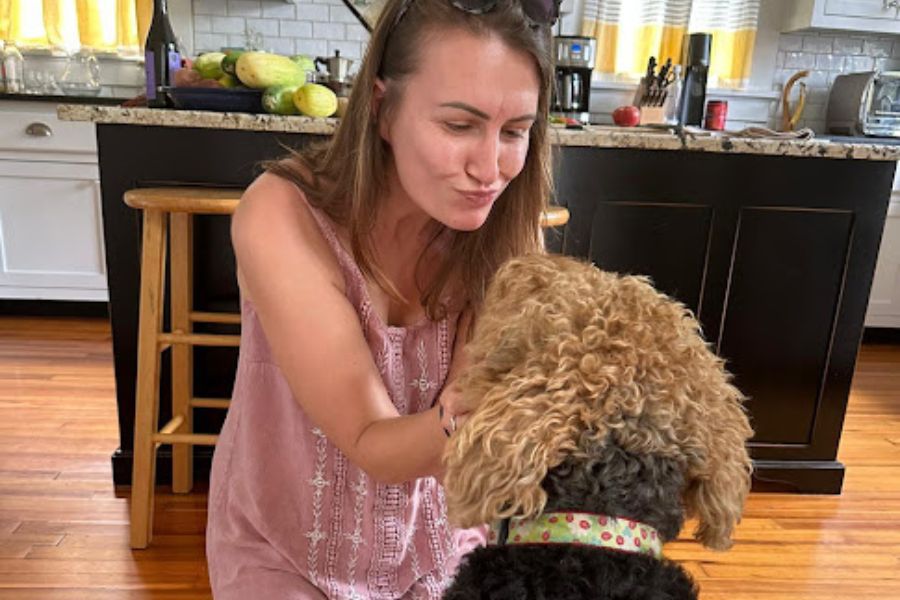 a woman stroking a dog