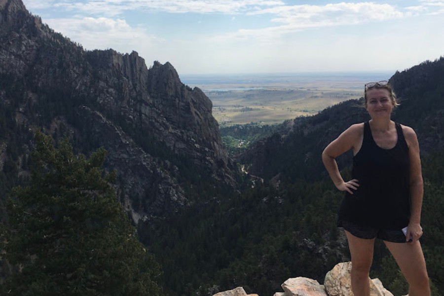 A woman poses for a selfie whilst out on a hike  in the Colorado hills