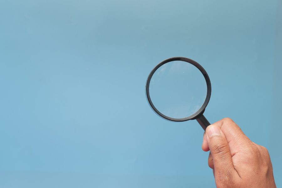 a magnifying glass against a blue background