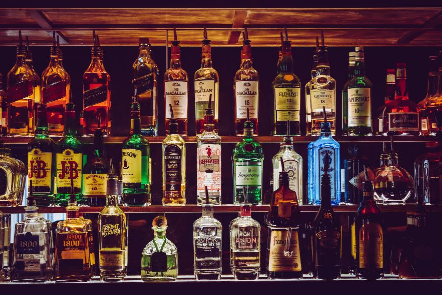 liquor bottles on bar shelves