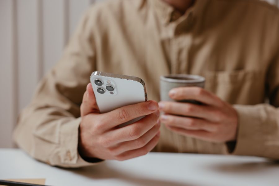 man looking at Iphone