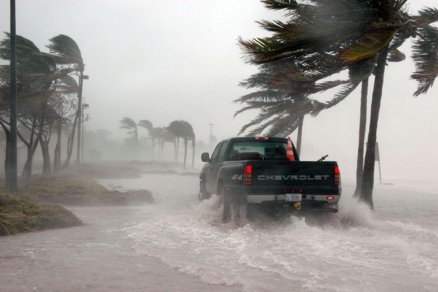 a car caught in a tropical storm and flood