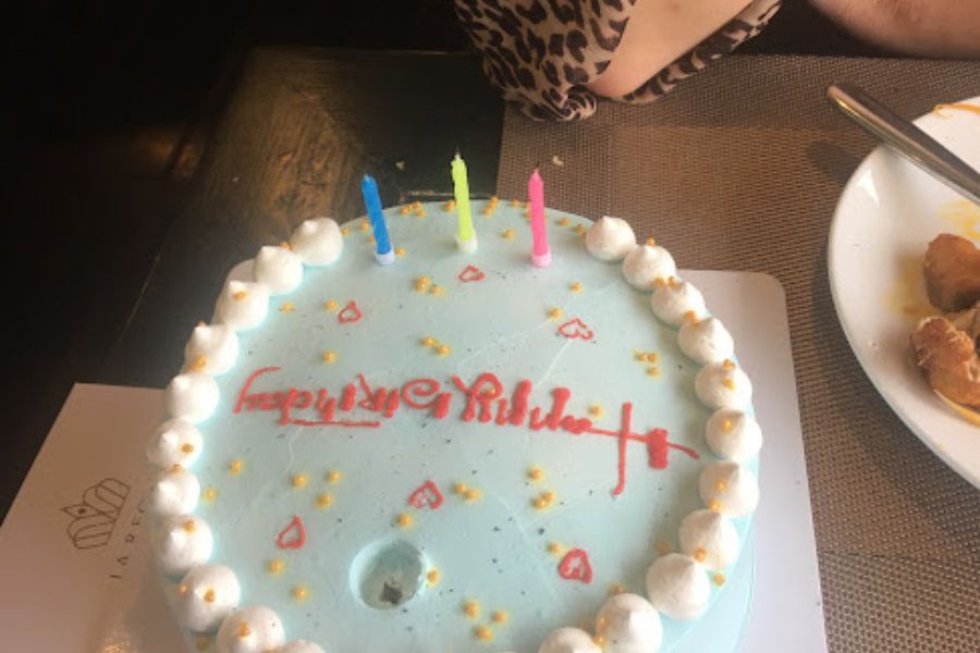 a birthday cake with three candles