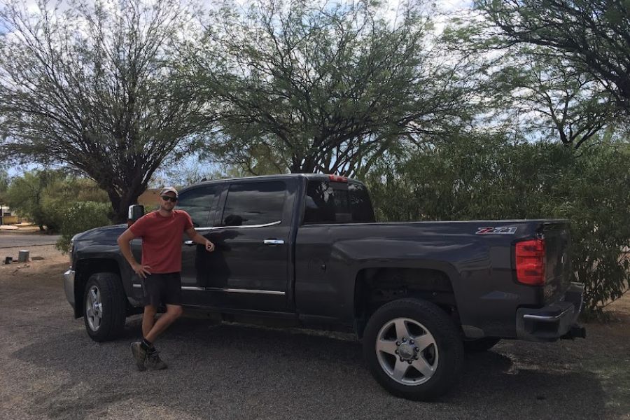 Man leaning on large 4x4