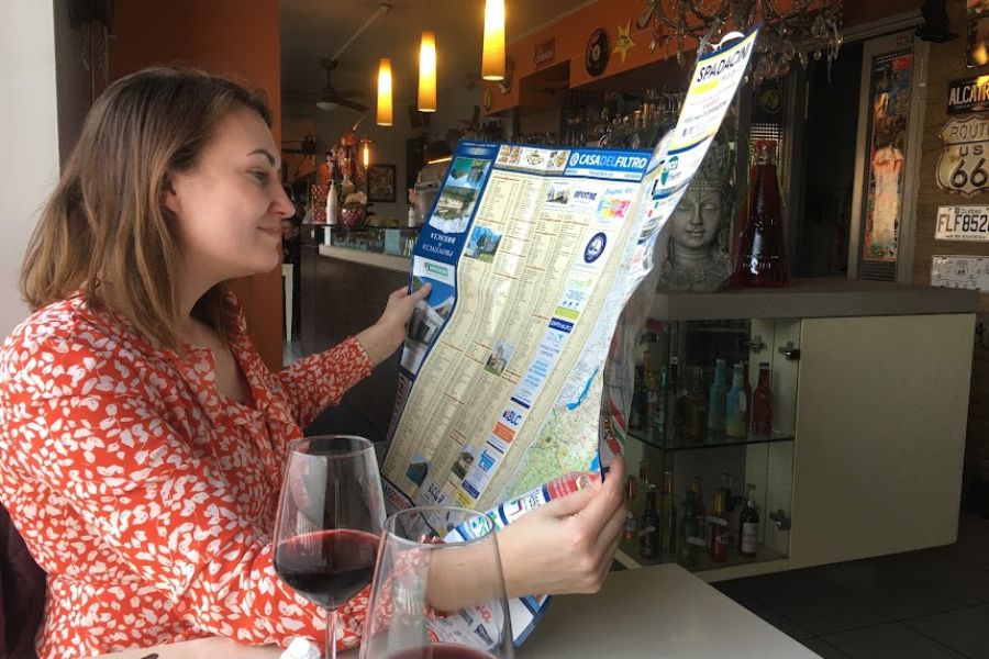 woman with map and wine