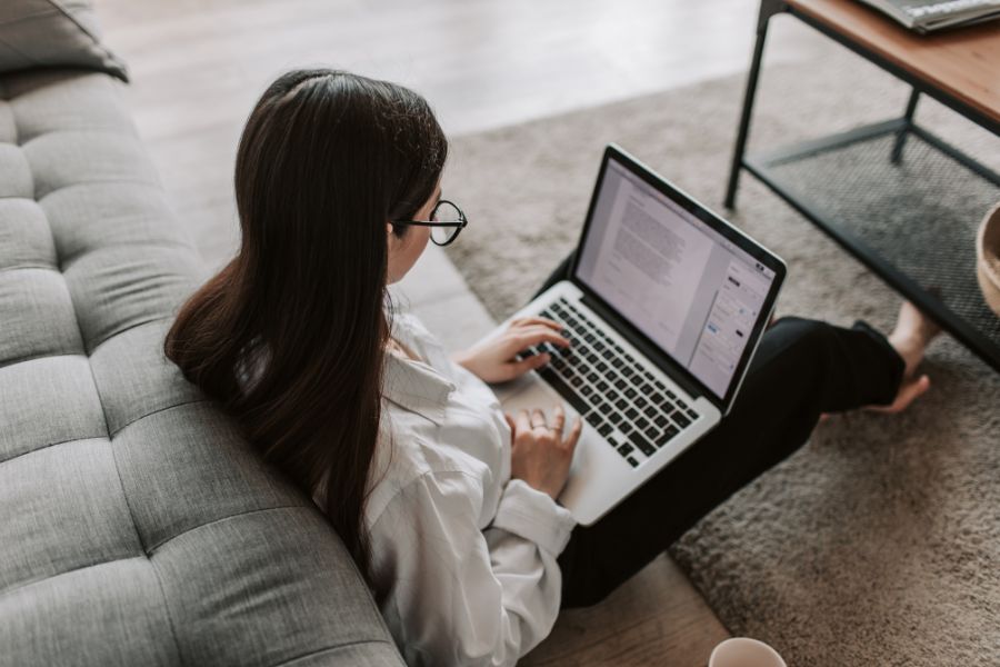 woman reading on a laptop