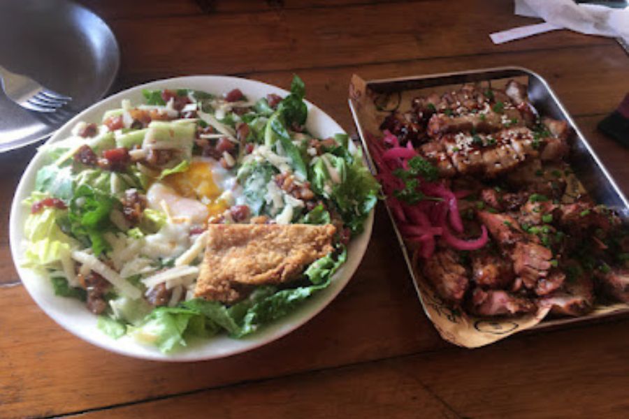 plates of salad and BBQ