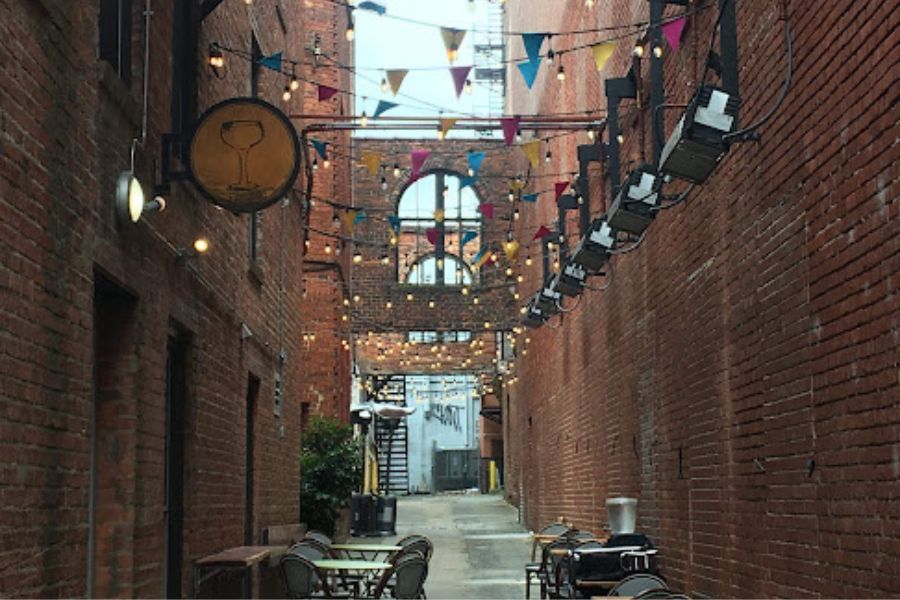 bunting and tables in an alleyway