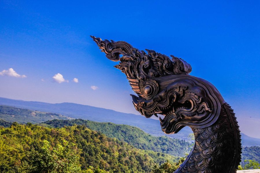 dragon statue against clear blue skies