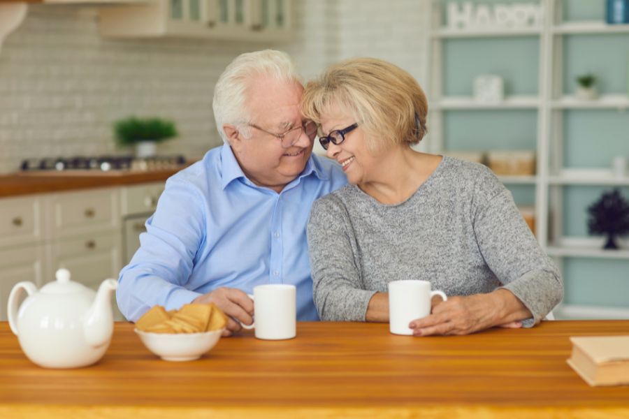 couple hugging and having a cup of tea