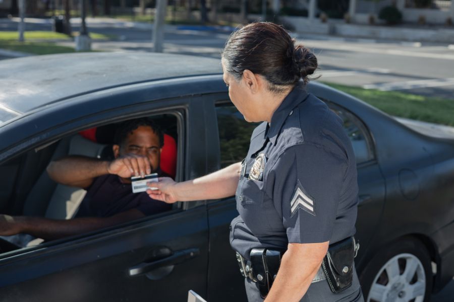 cop checking a drivers ID