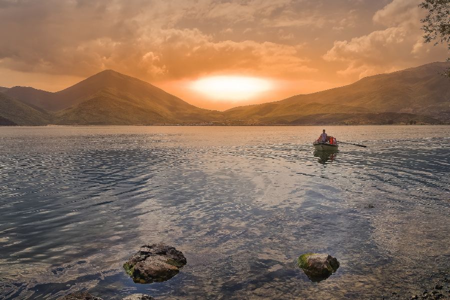 row boat on an expansive lake in Albania