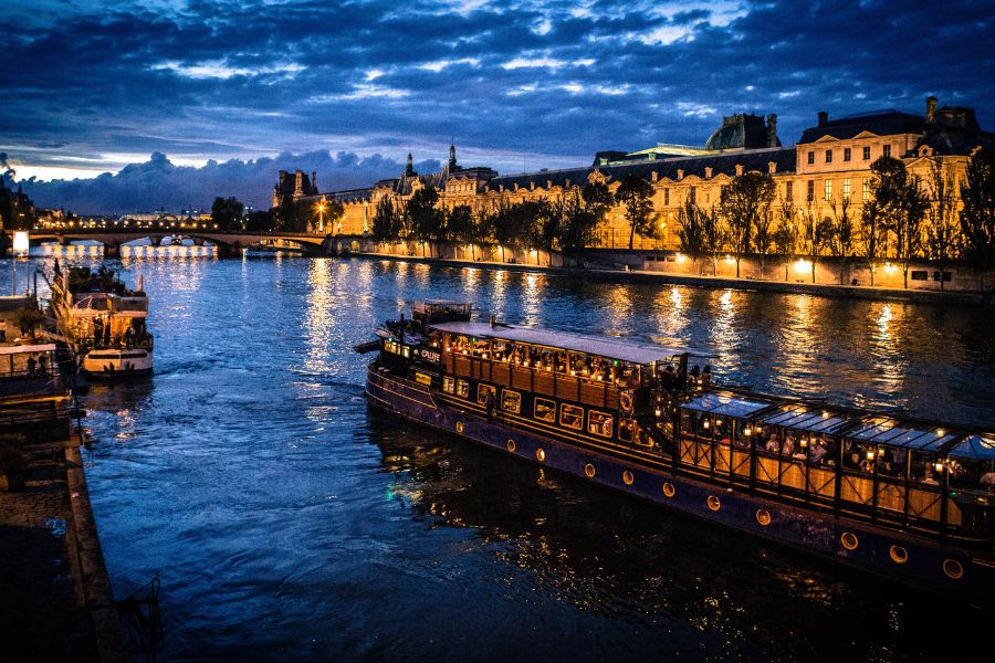 Seine river and boat at night