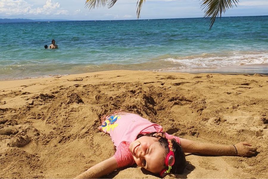 child enjoying the beach